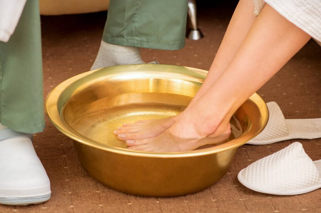 Soak your feet in foot bath to get rid of bunions